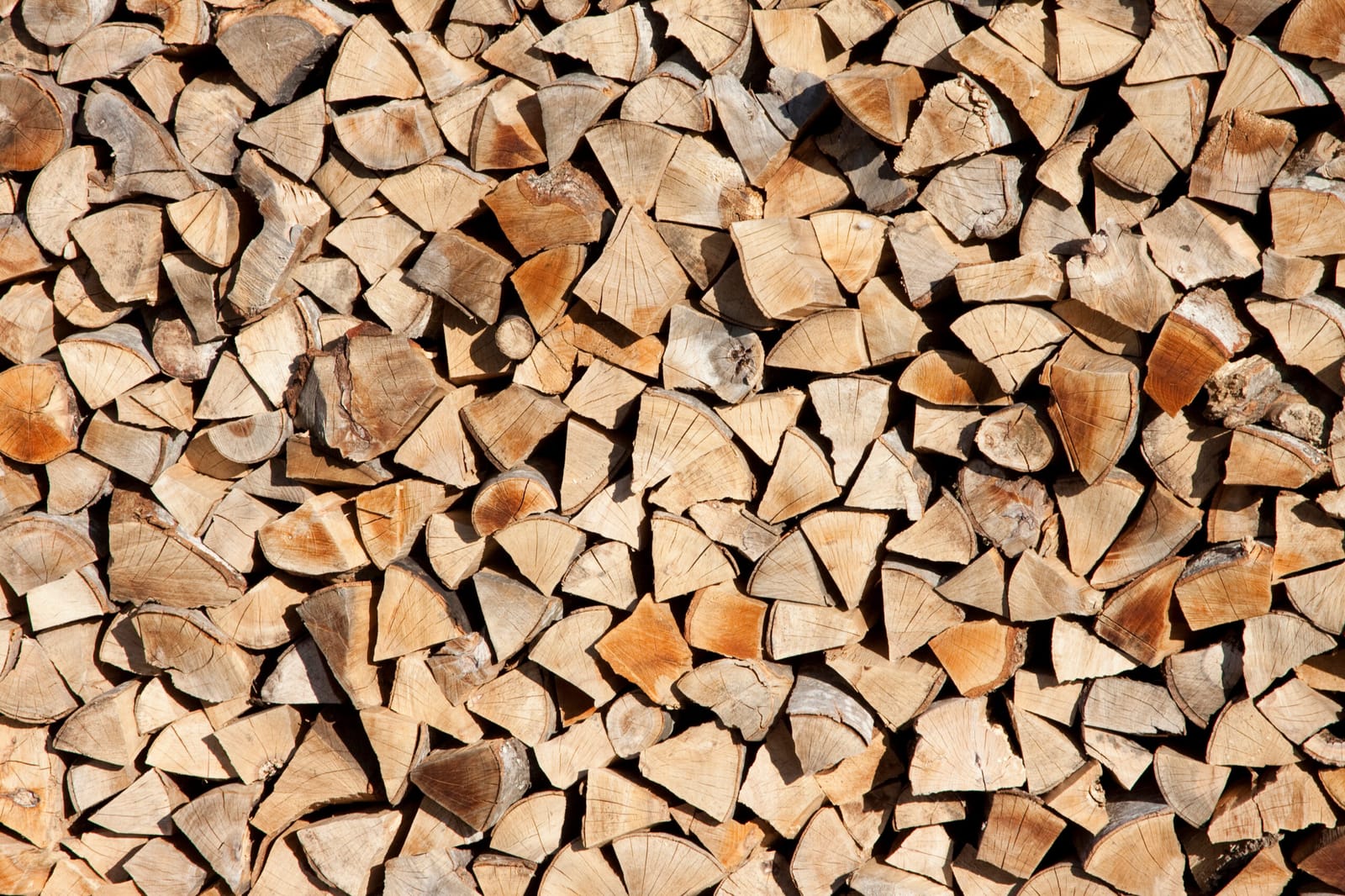 A large stack of split firewood ready for the winter heating season